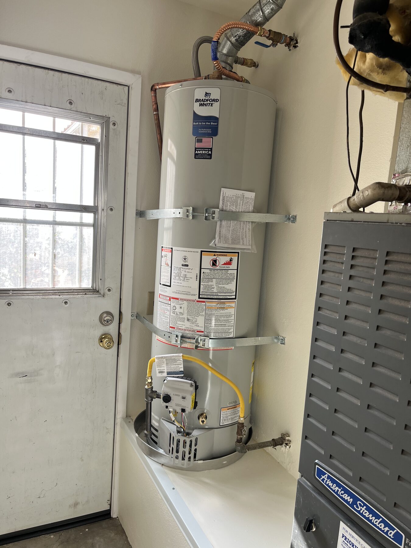 New Bradford White gas water heater installed with seismic straps, copper lines and a fresh gas connection